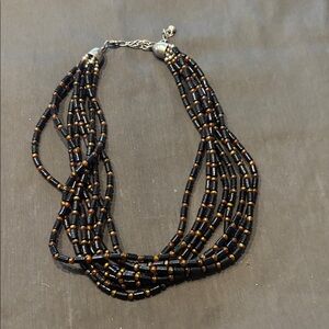 Wood beaded necklace with sterling detail.